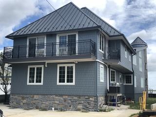 Here is the finished product of the beach home renovation. Now equipped to face hurricane-level winds, maintain steady indoor temperatures on hot and cold days, and keep up a gorgeous, unique look for a very long time.