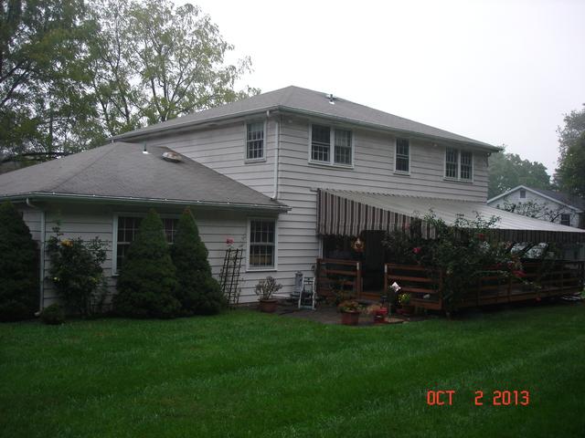 Vermont Blue Metal Slate Roof, Tuscan Clay Beaded Insulated Vinyl Siding, Custom Marvin Infinity Double Hung Fiberglass Windows, and Rear Porch Portico Installation in Lafayette Hill, PA