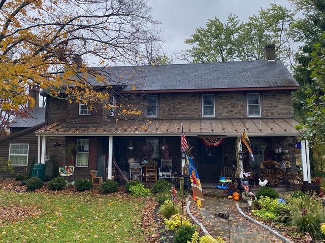 Stained Asphalt Roofs Get a Standing Seam Metal Makeover