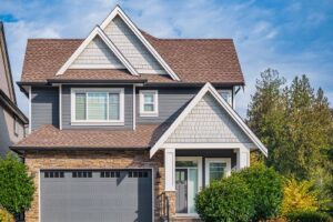 exterior of home with new siding, roofing, and windows