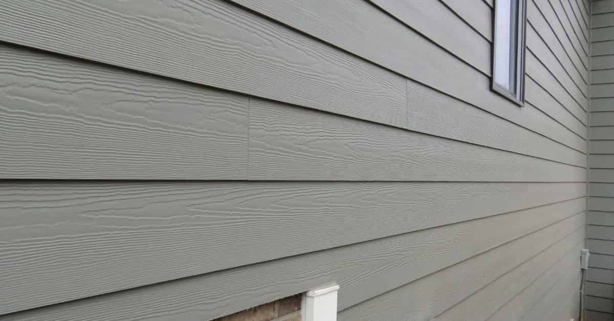 A close-up view of a gray siding of a house.